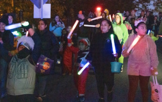 Halloween paraders with glo sticks